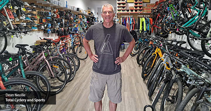 Dean Neville in his store of Total Cyclery and Sports